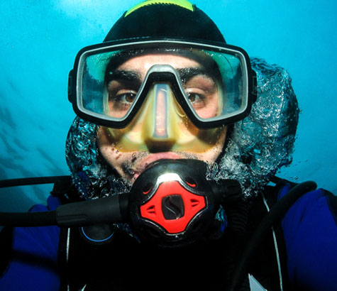 Scuba diver underwater with clear mask